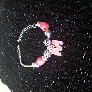 "M" monogram bracelet.